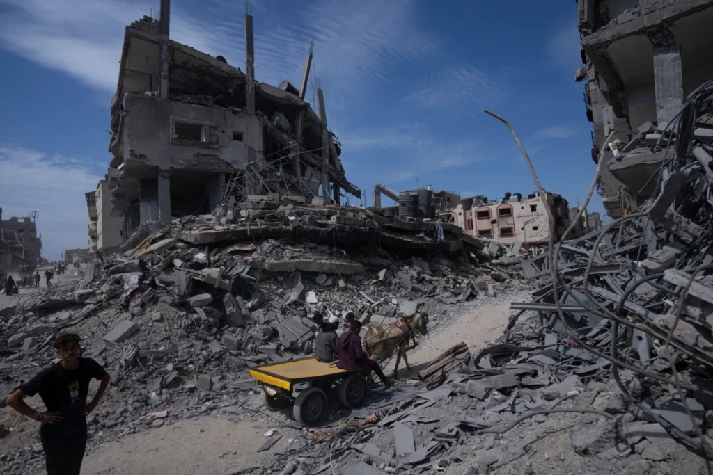 Victims include 15 civilians reportedly waiting for aid as air raids intensify across the besieged enclave