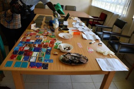 Detectives recover phones, SIM cards, and credit cards in multi-agency raid at Mwea town apartment